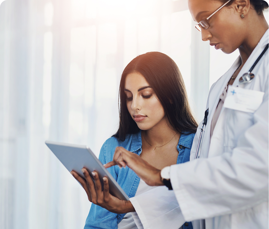 Doctor consulting patient using a tablet.