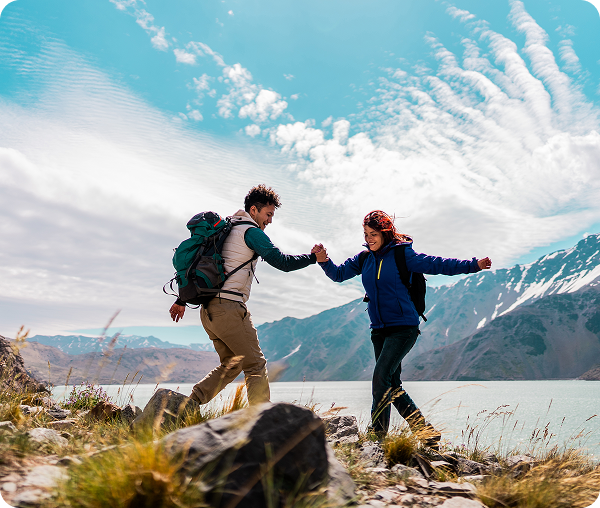 Hikers enjoying scenic mountain and lake view.