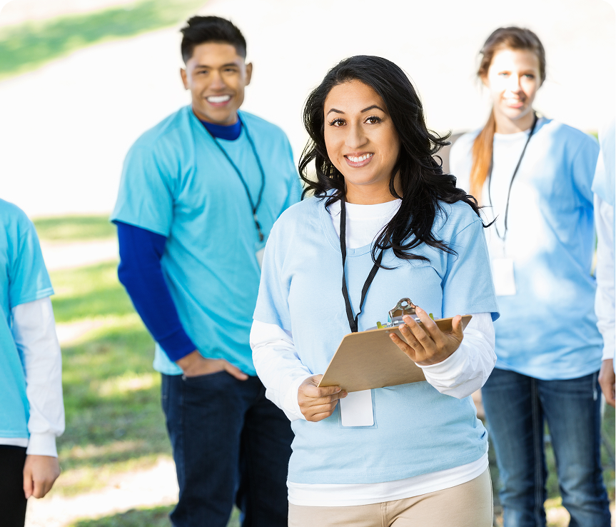 Group of volunteers wearing blue shirts.